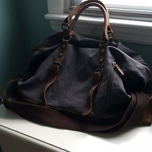 Grey with brown leather travel bag